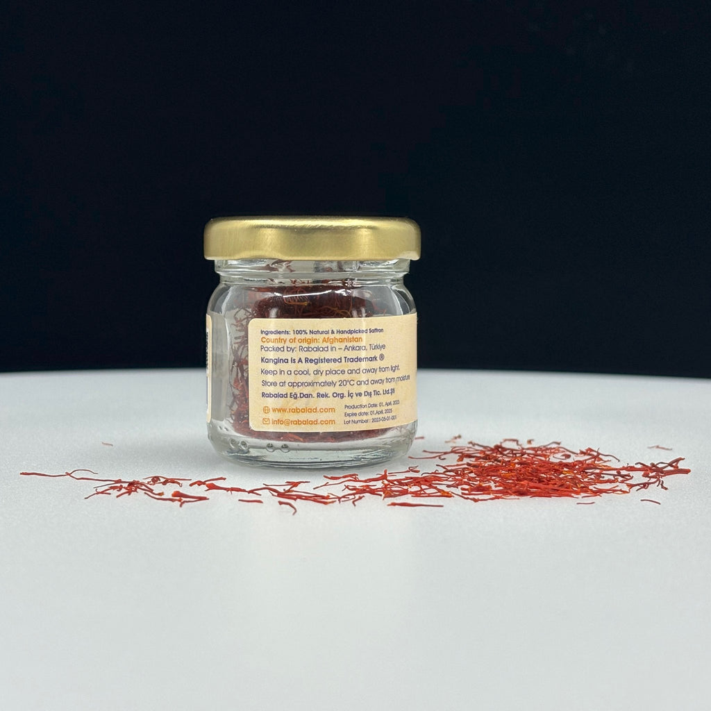 Premium Afghan Saffron 2g glass jar behind English