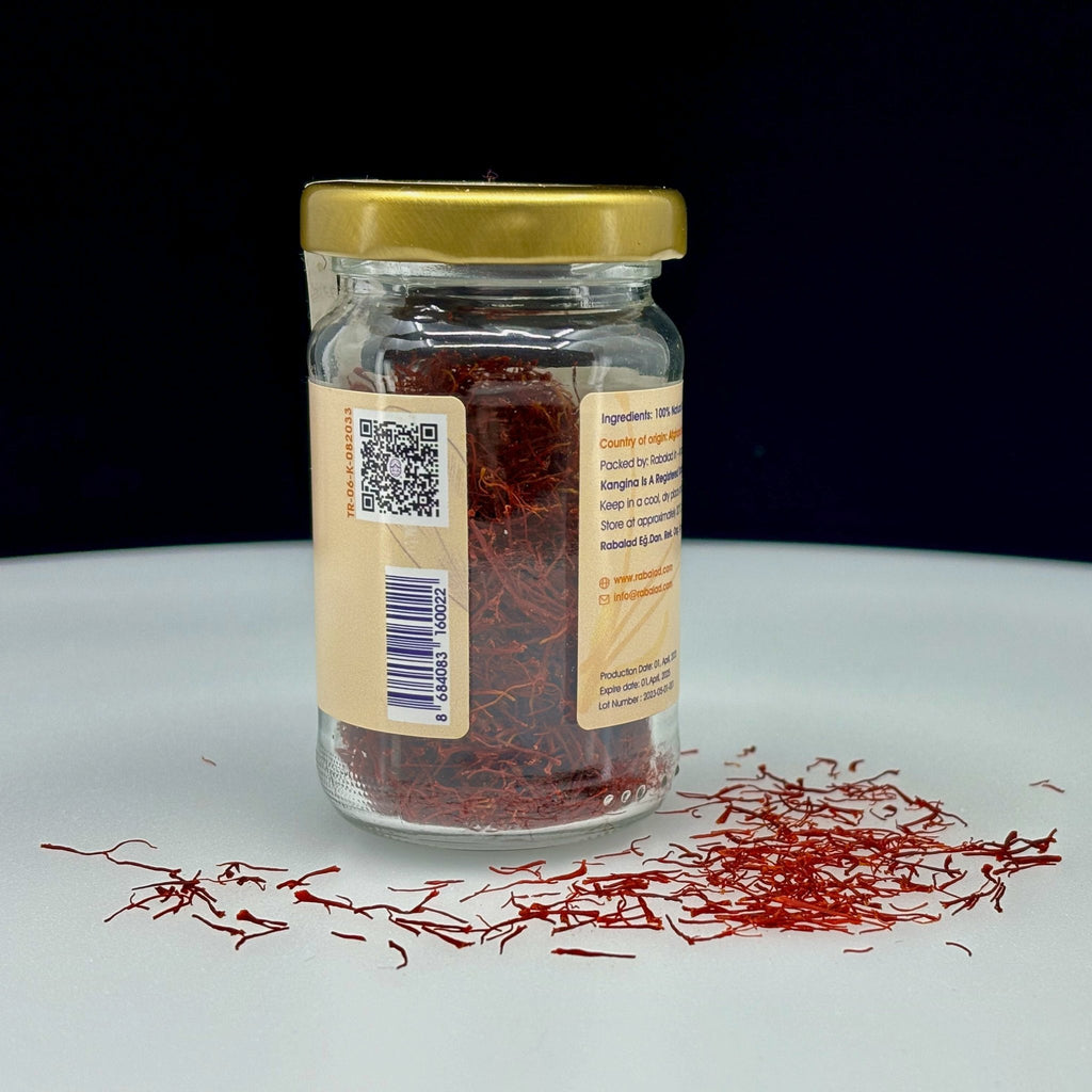 Premium Afghan Saffron 5g glass jar behind English